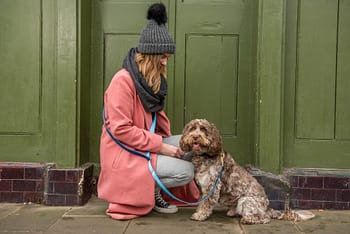 girl with dog on handsfree lead